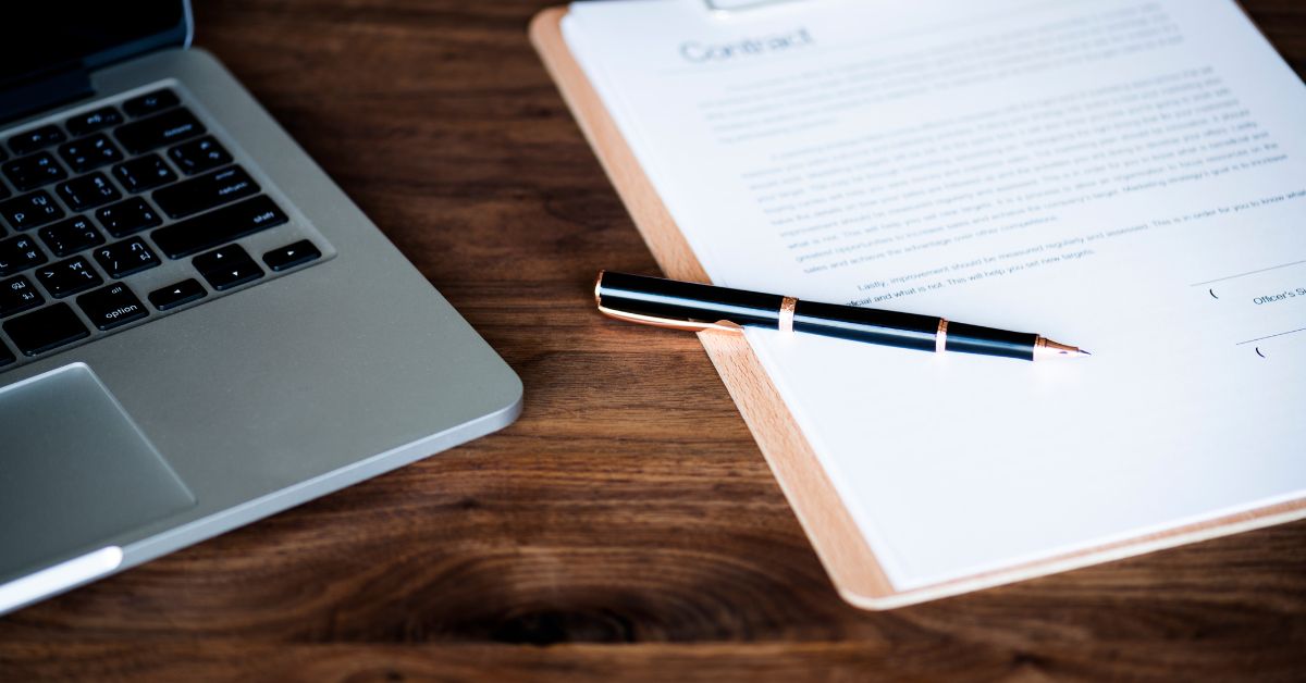 Hand signing a business contract under a Singapore private limited company